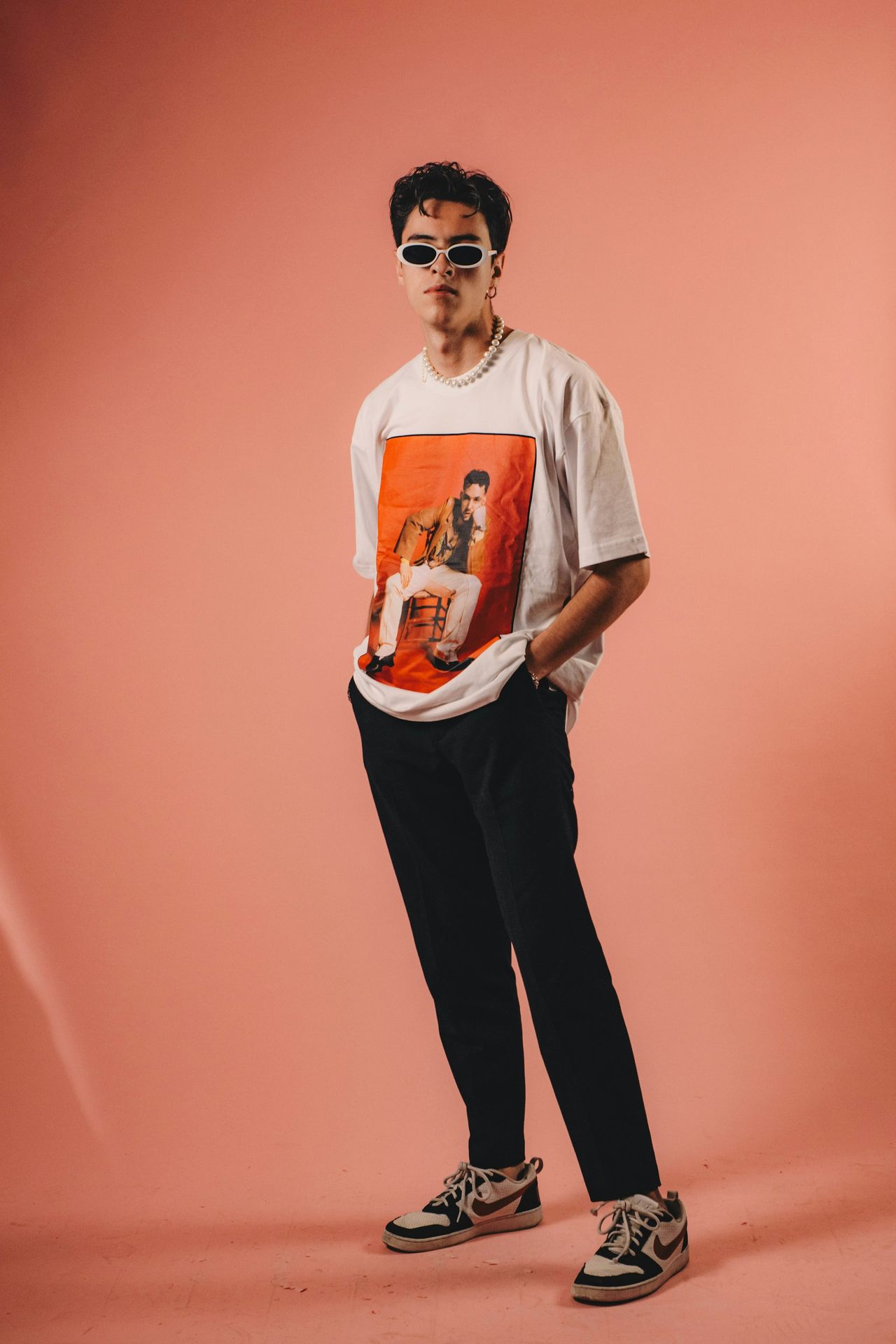 a man wearing a t - shirt with a picture of a man on it